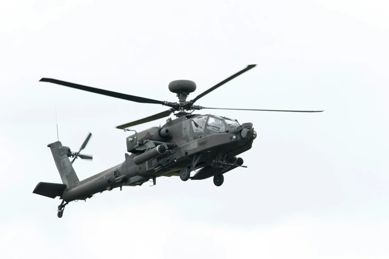A Danish military Fennec helicopter in flight over water