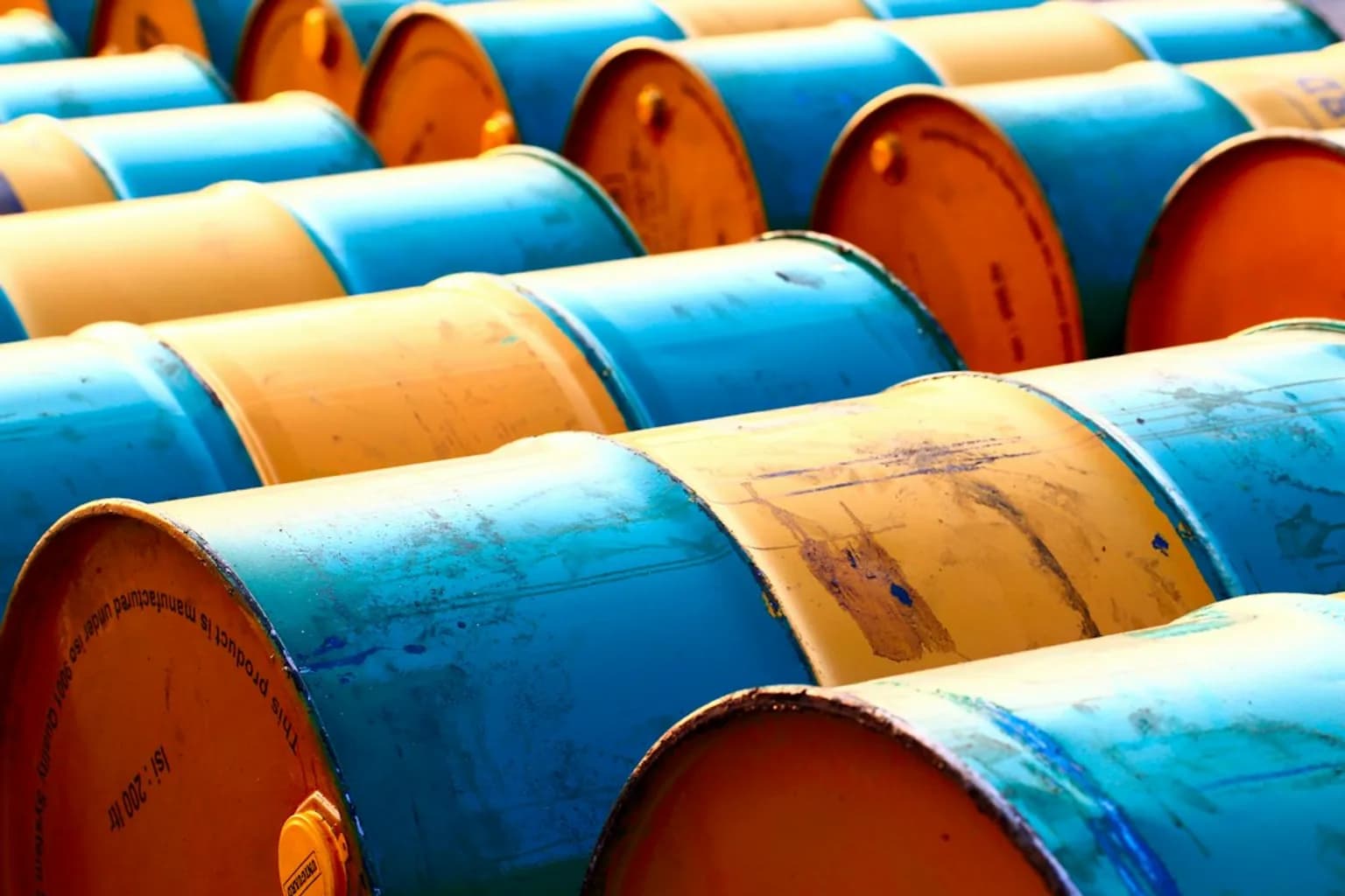 Large cylindrical oil storage tanks at a petroleum refinery