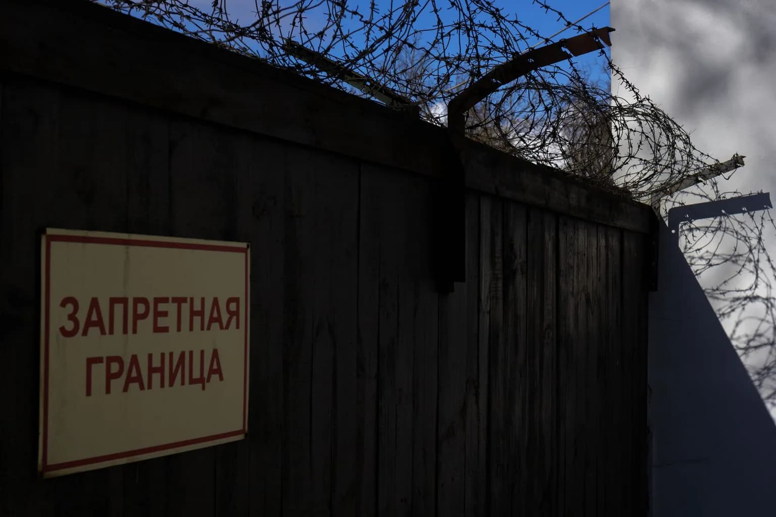 Fence and warning signs along the Korean Demilitarized Zone border
