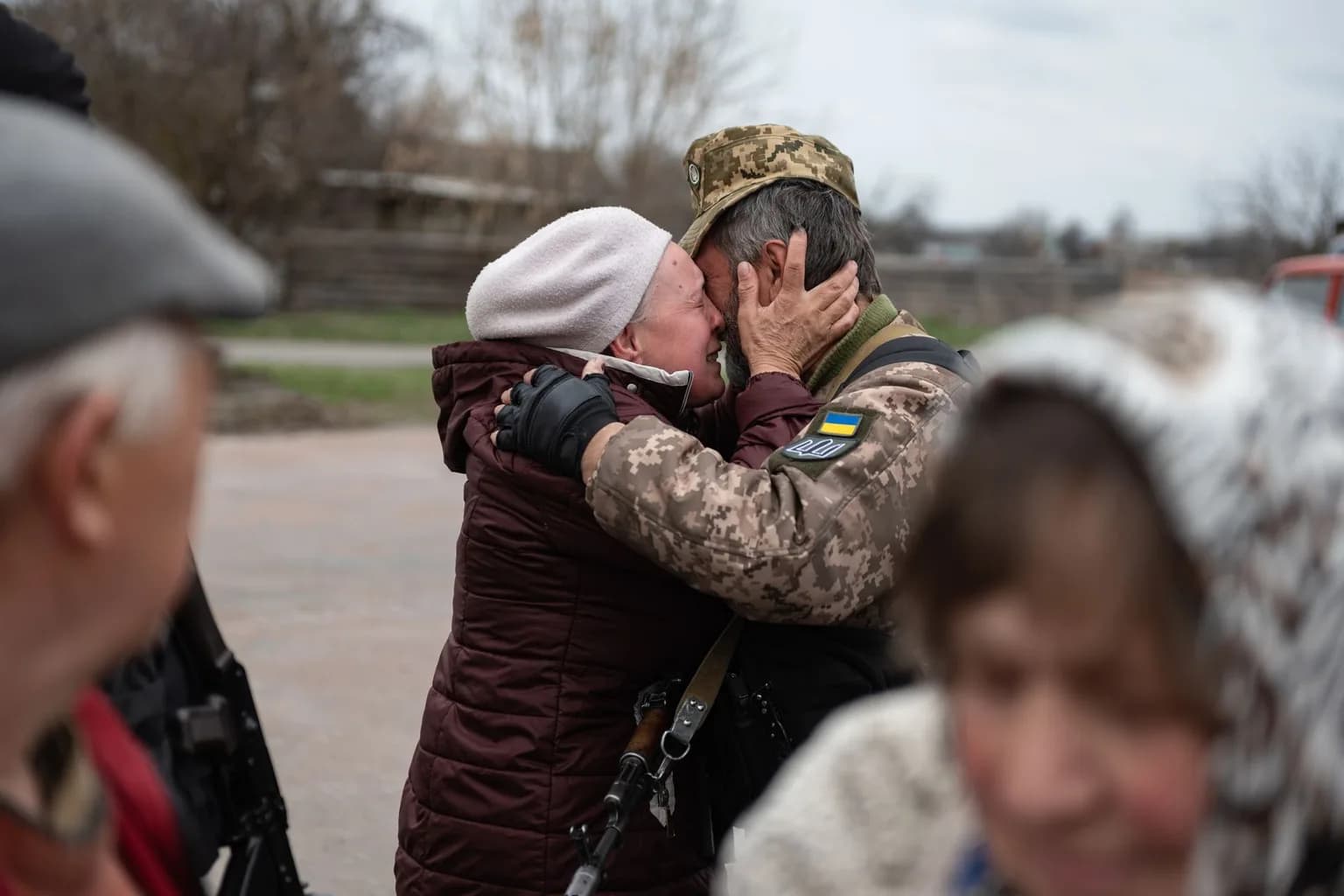 Civilians with luggage at a checkpoint during an evacuation in Ukraine's Kherson region