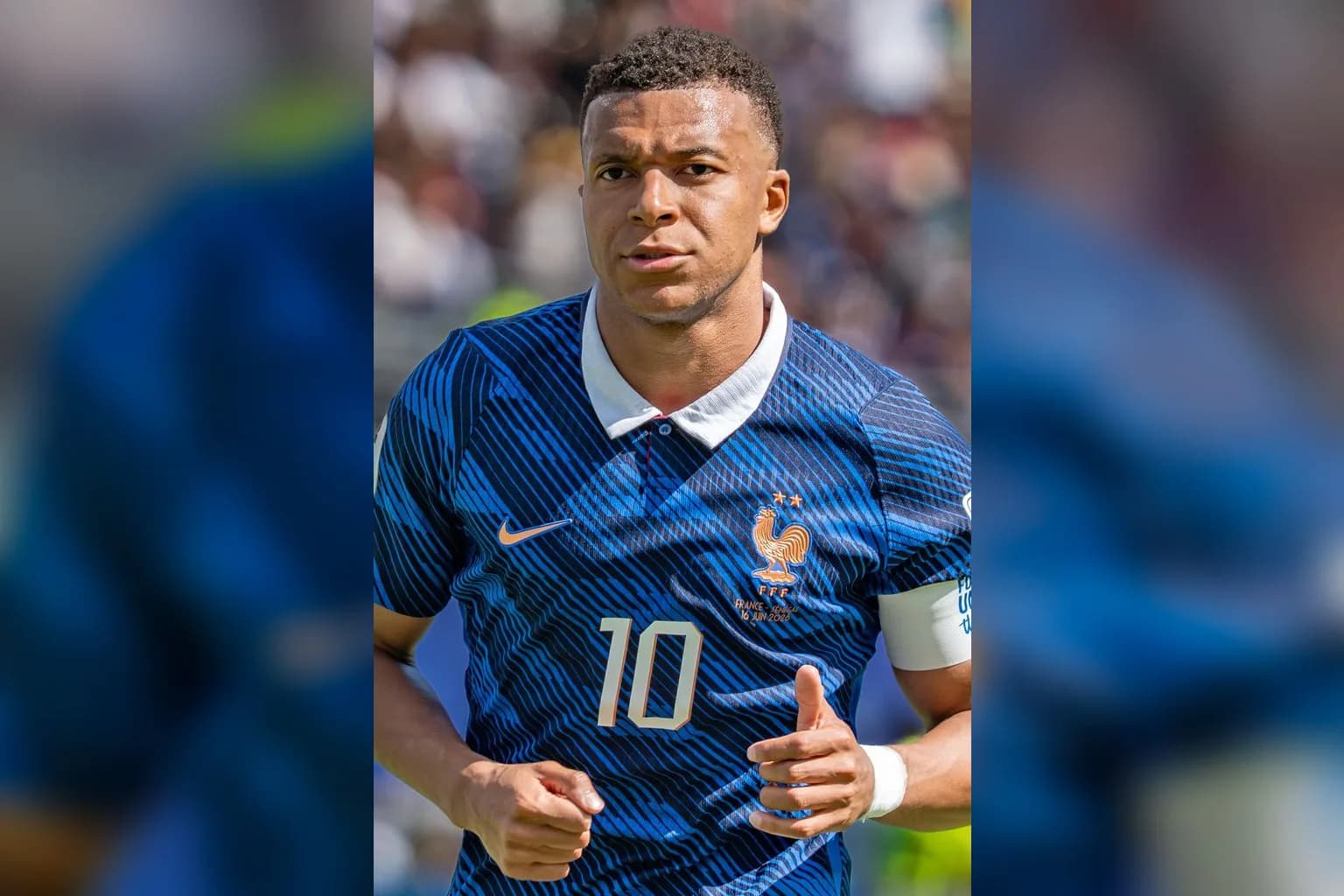 Kylian Mbappé in action on a football pitch