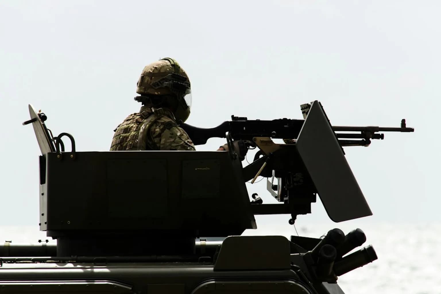 A soldier shoulders a portable surface-to-air missile launcher during a military exercise