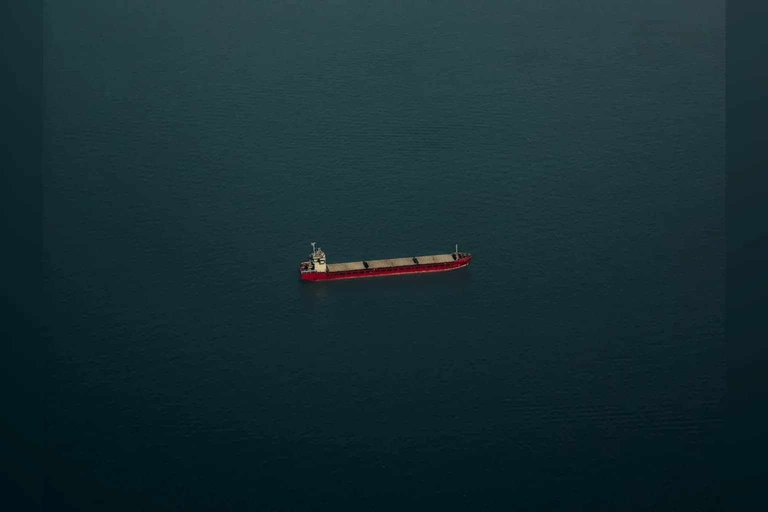 A commercial passenger aircraft flying over open water
