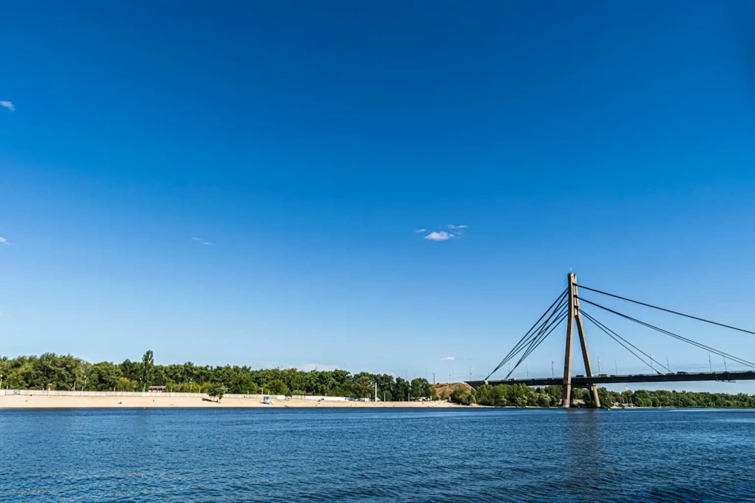 The Southern Bridge spanning the Dnipro River in Kyiv, carrying road and metro traffic between the city's eastern and western banks.