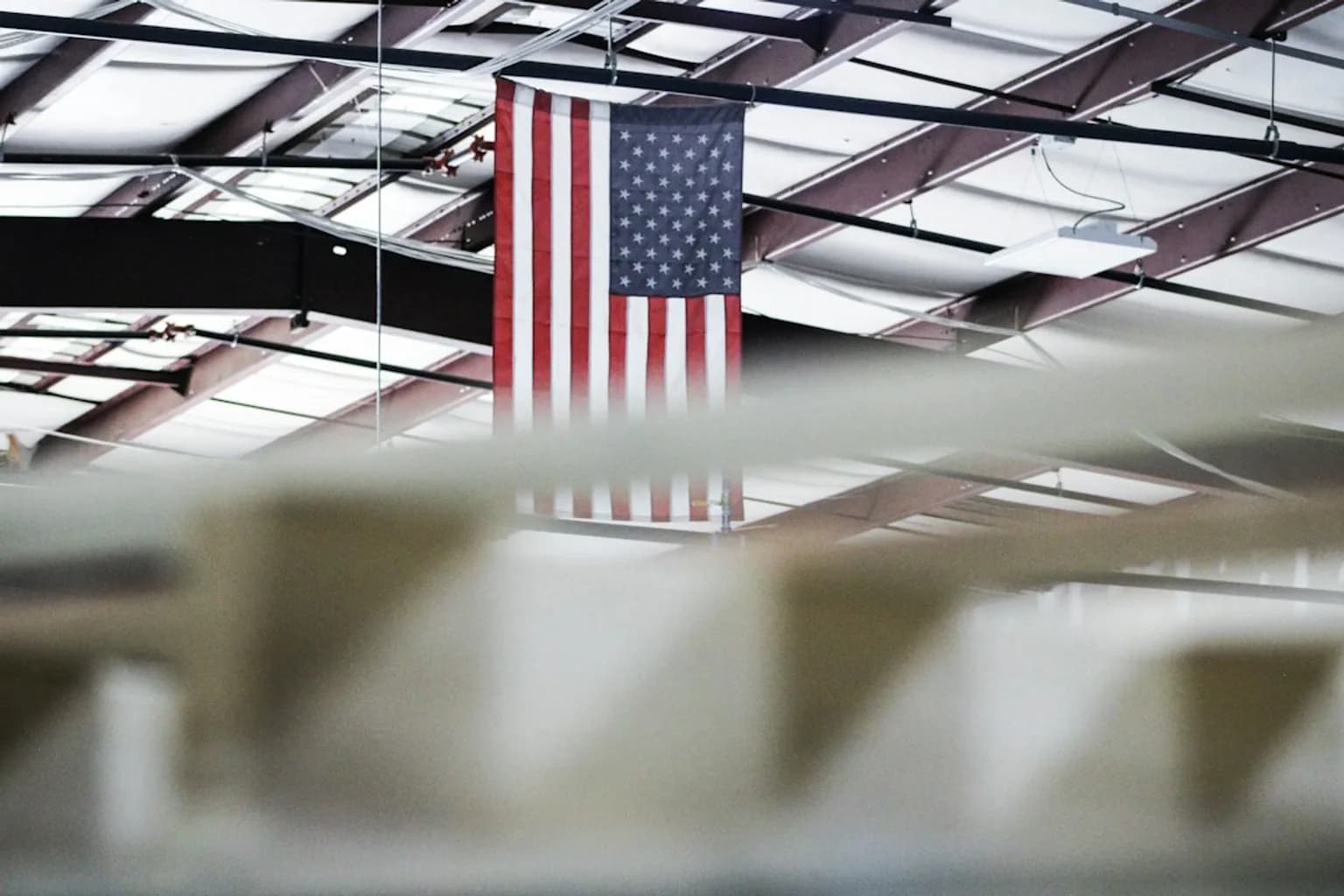 Workers on a US manufacturing or warehouse floor amid supply chain activity