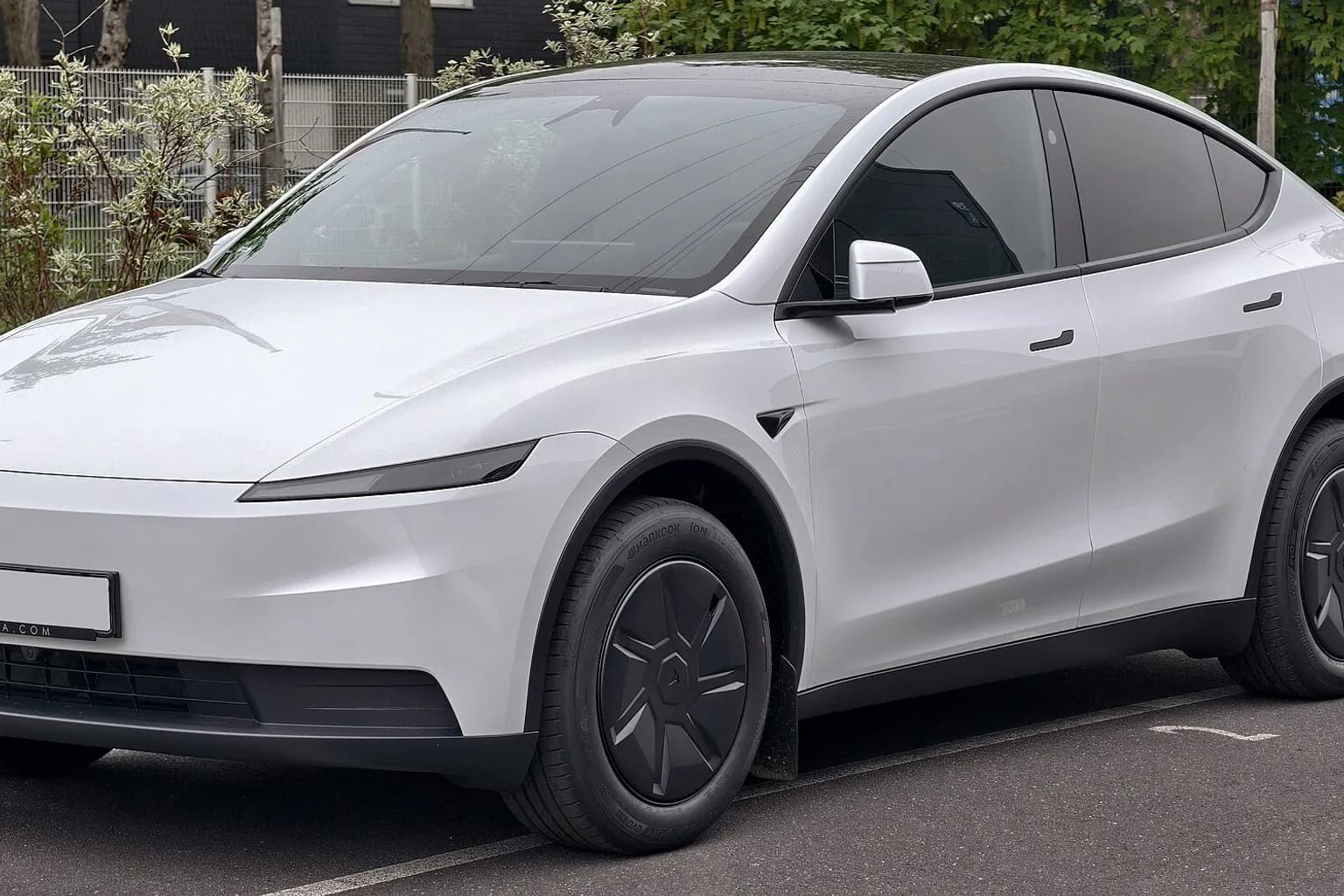 A Tesla Model Y electric SUV on a road