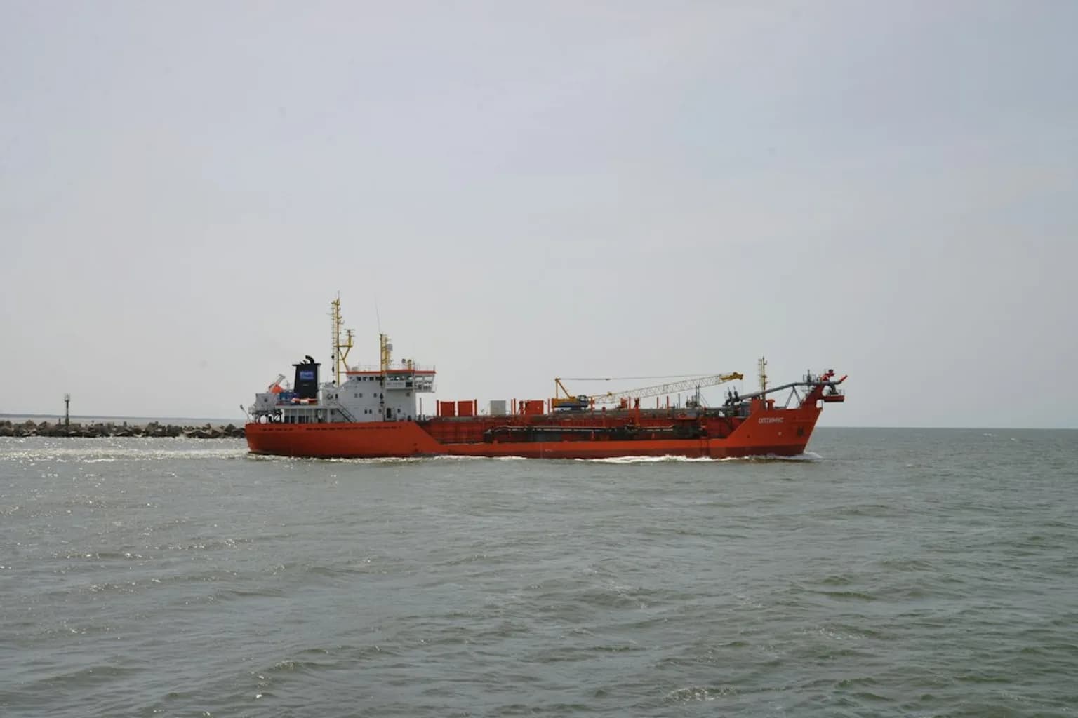 A bulk carrier vessel underway on open water in the Red Sea region