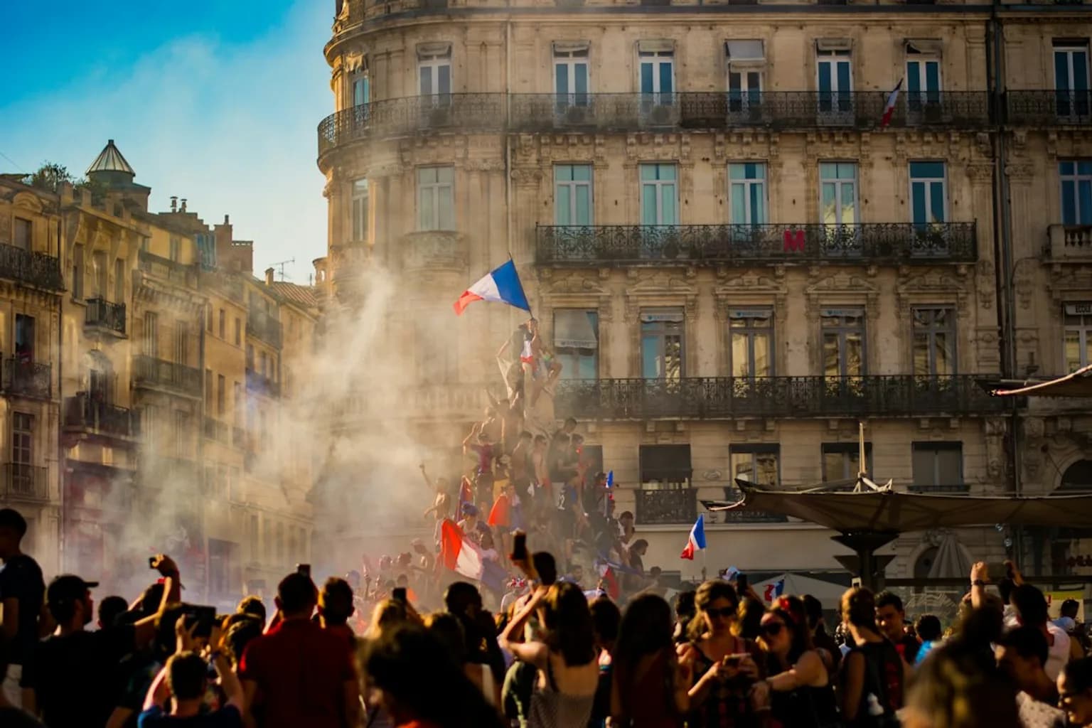 Protesters marching through a French city street during cost-of-living demonstrations