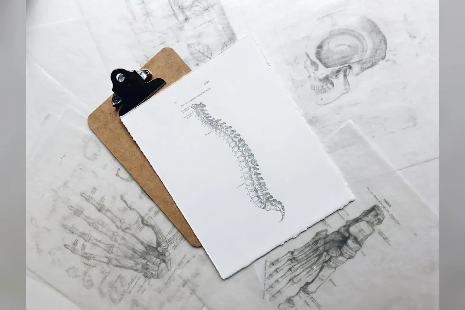 A person holding their head in pain, illustrating chronic pain research findings