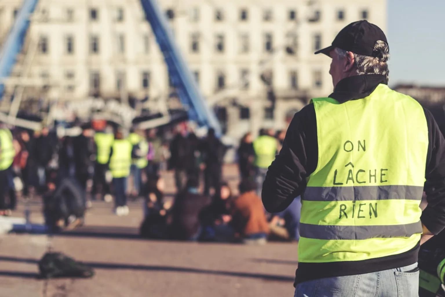Protesters march through a French city during Yellow Vests demonstrations, with crowds filling the street