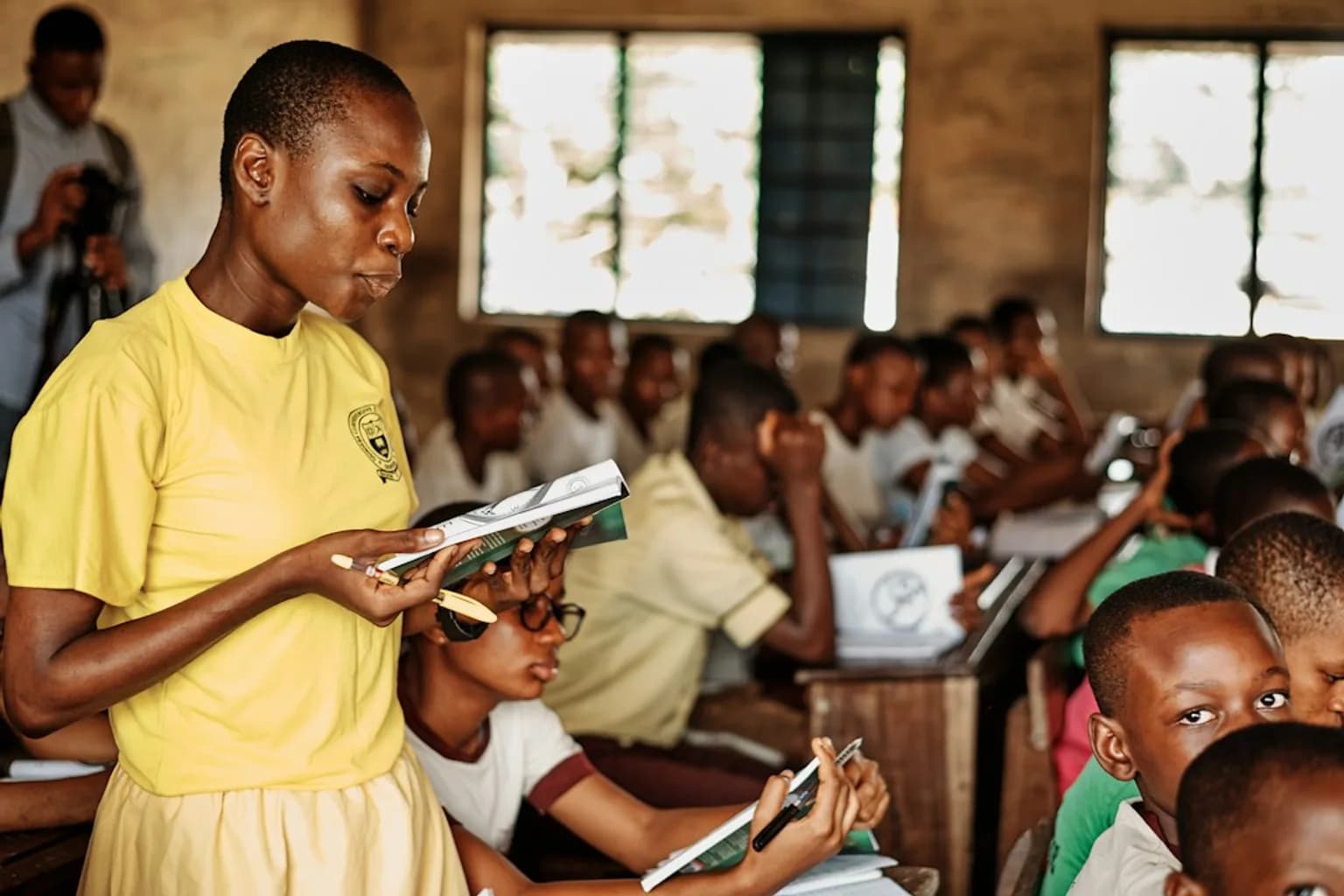 Refugee children sitting in a classroom, studying together