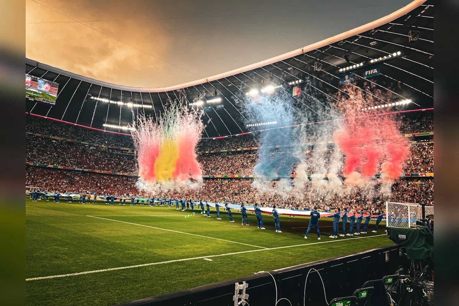 Pitchside advertising boards visible inside a World Cup stadium during a match