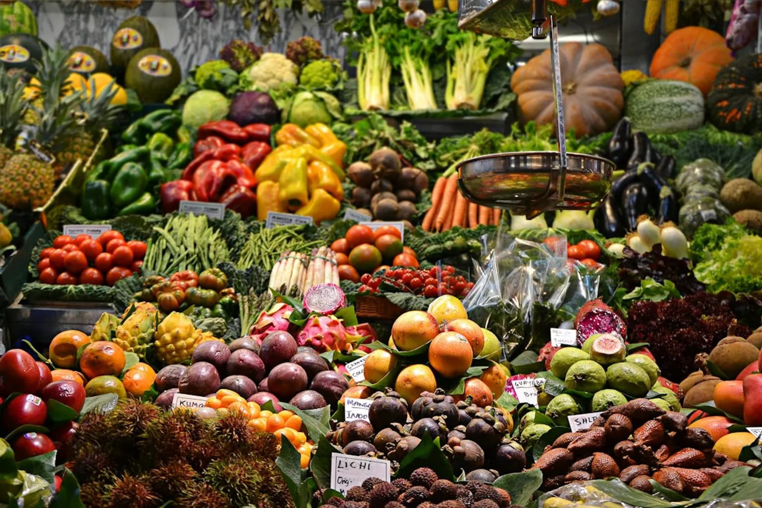 An assortment of fresh fruits and vegetables displayed at a market stall