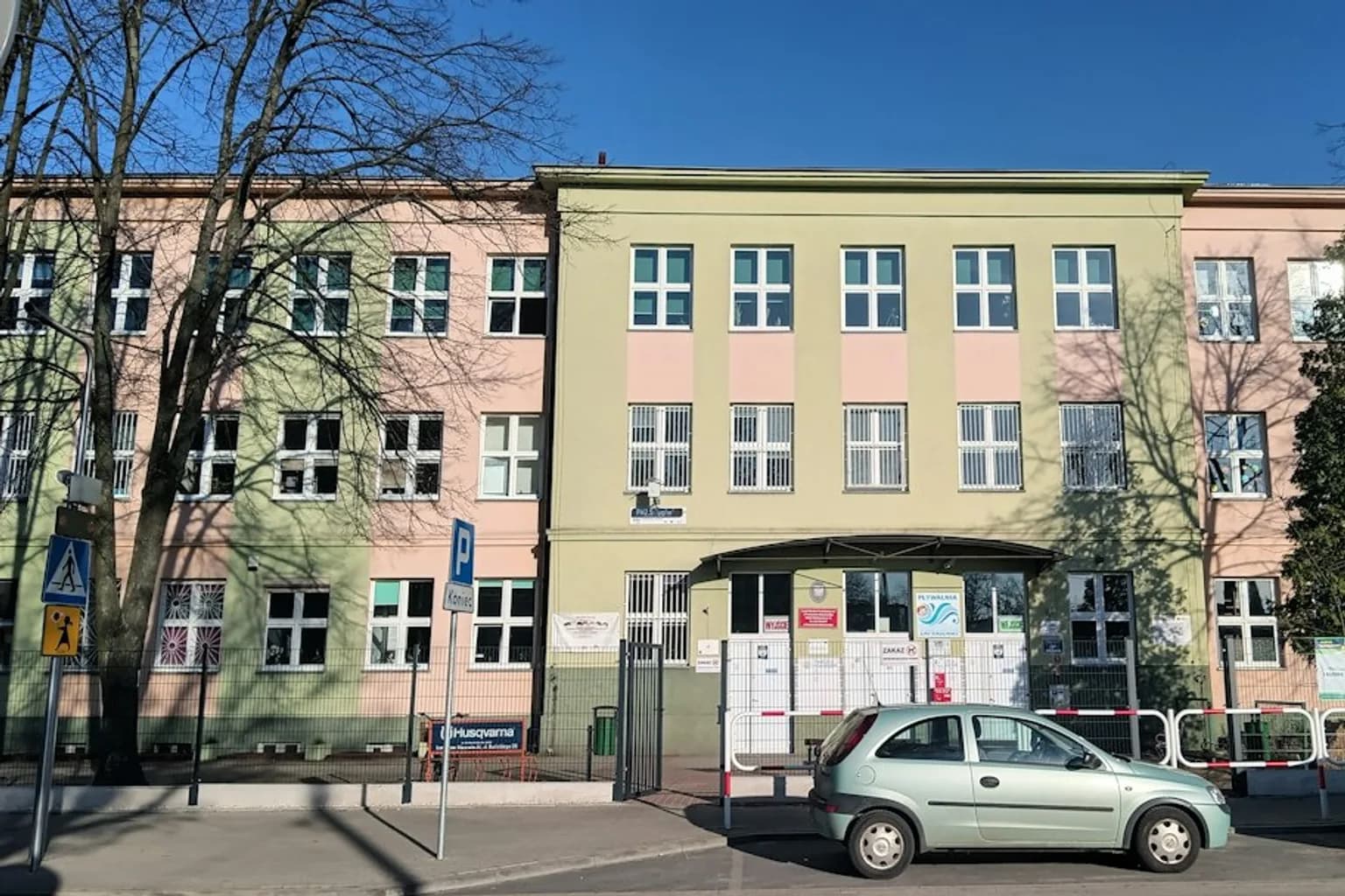 Police officers standing guard outside a school building in Poland