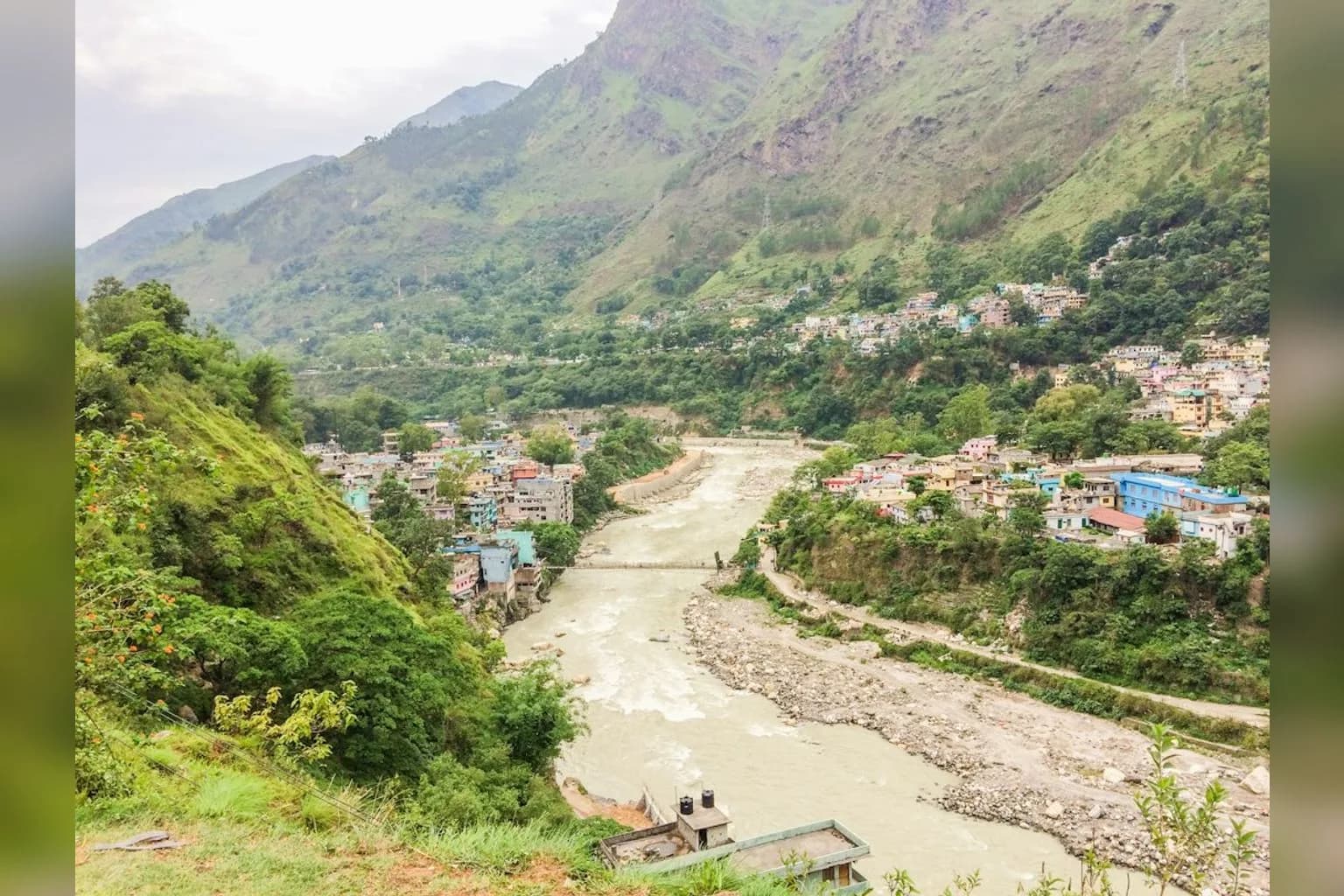 Floodwater flowing through a river valley in Nepal's Gorkha district following a landslide dam breach