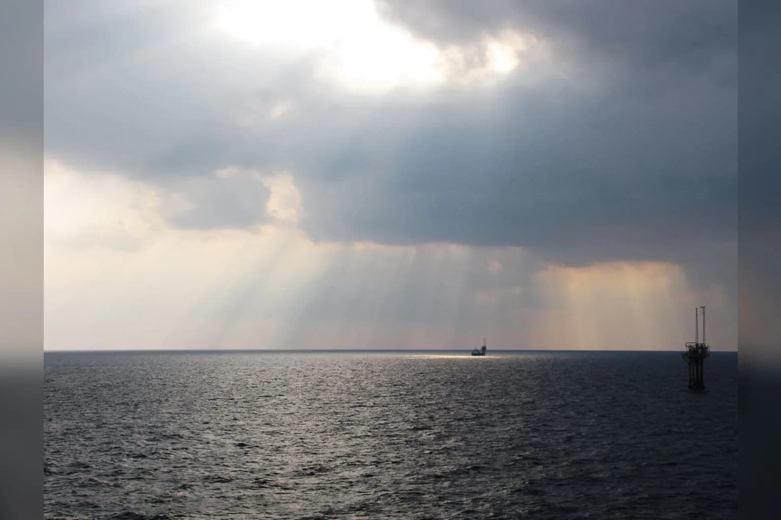 Cargo vessels transit the Strait of Hormuz, the narrow waterway linking the Persian Gulf to the Gulf of Oman