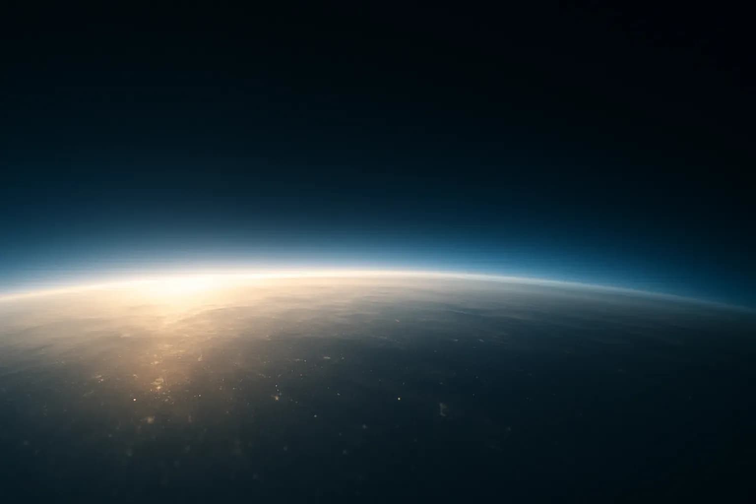 Sunlight scattering through a faint stratospheric haze above a curved Earth horizon, representing solar radiation modification research.