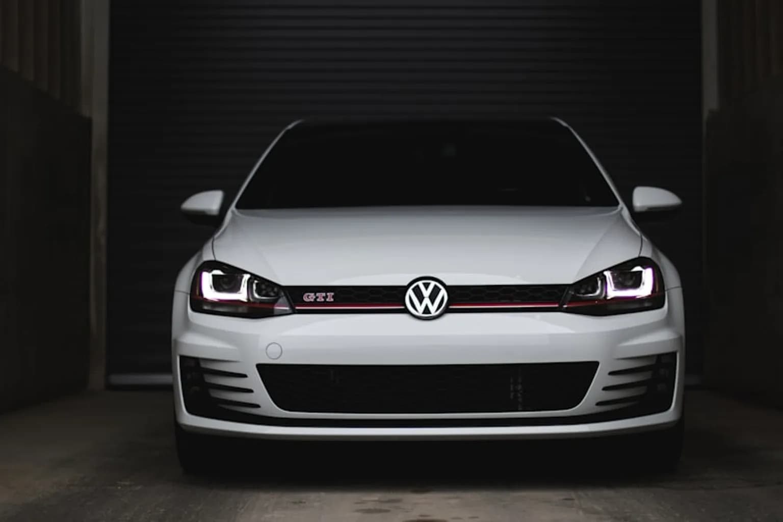 A Volkswagen vehicle at a dealership service centre during a recall inspection
