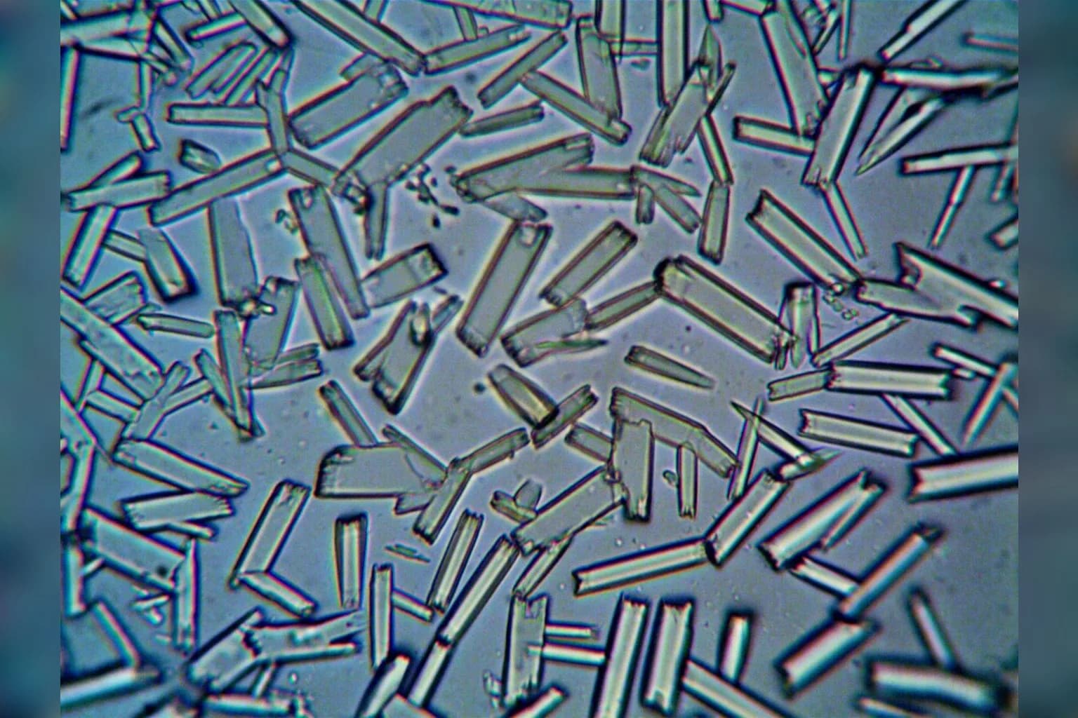 A glowing crystal sample used in nuclear clock research inside a laboratory setting