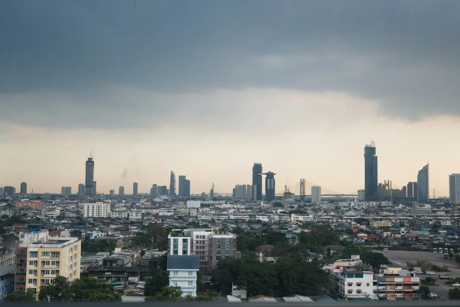 A hazy, smog-filled city skyline obscured by air pollution