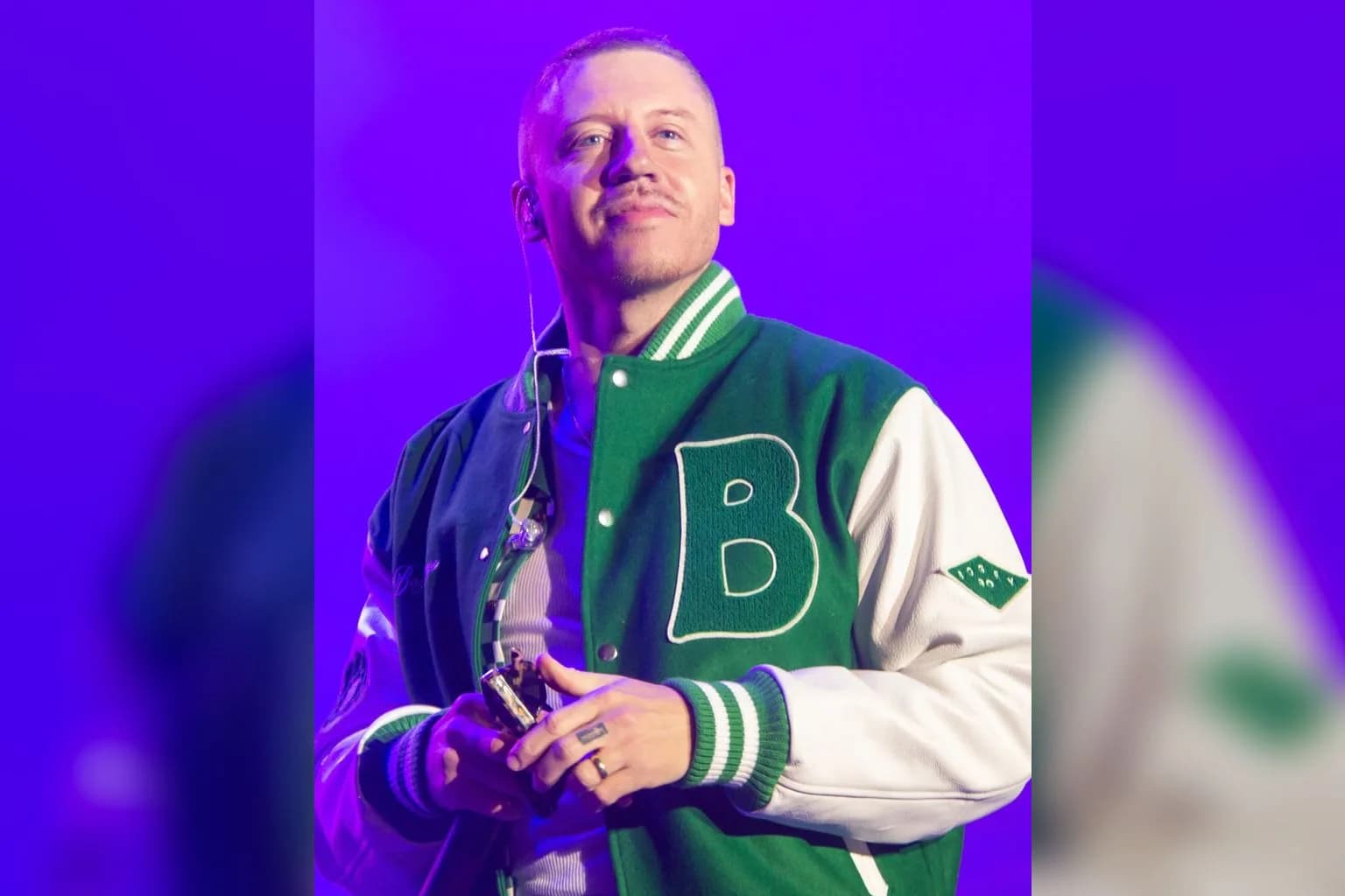 Macklemore performing on stage