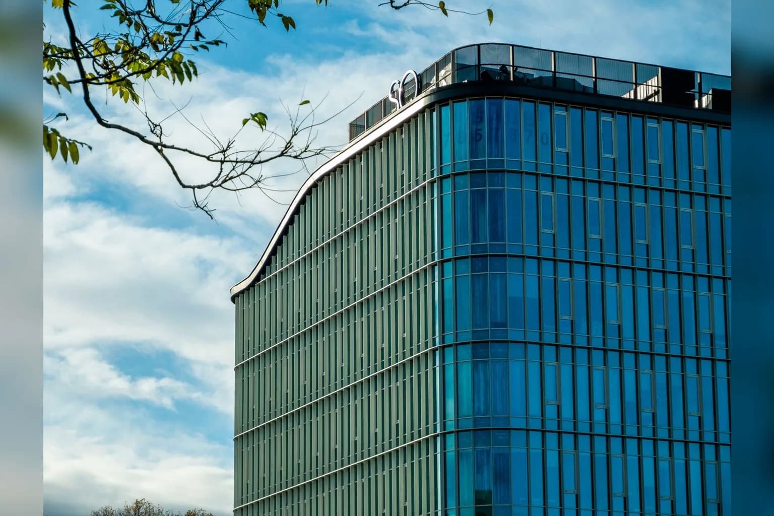 OpenAI logo on a screen or building exterior