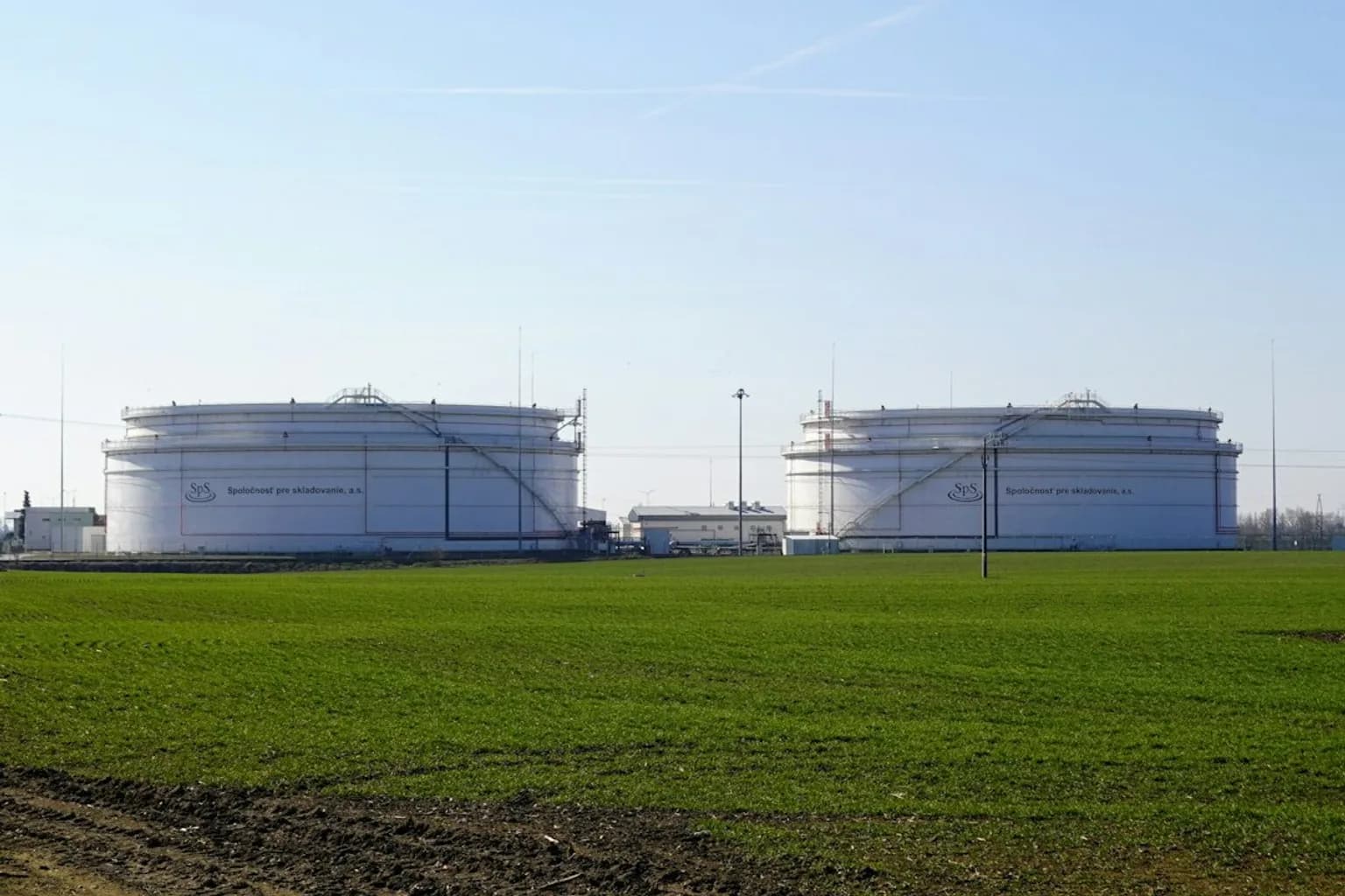 Large cylindrical oil storage tanks at a strategic petroleum reserve facility