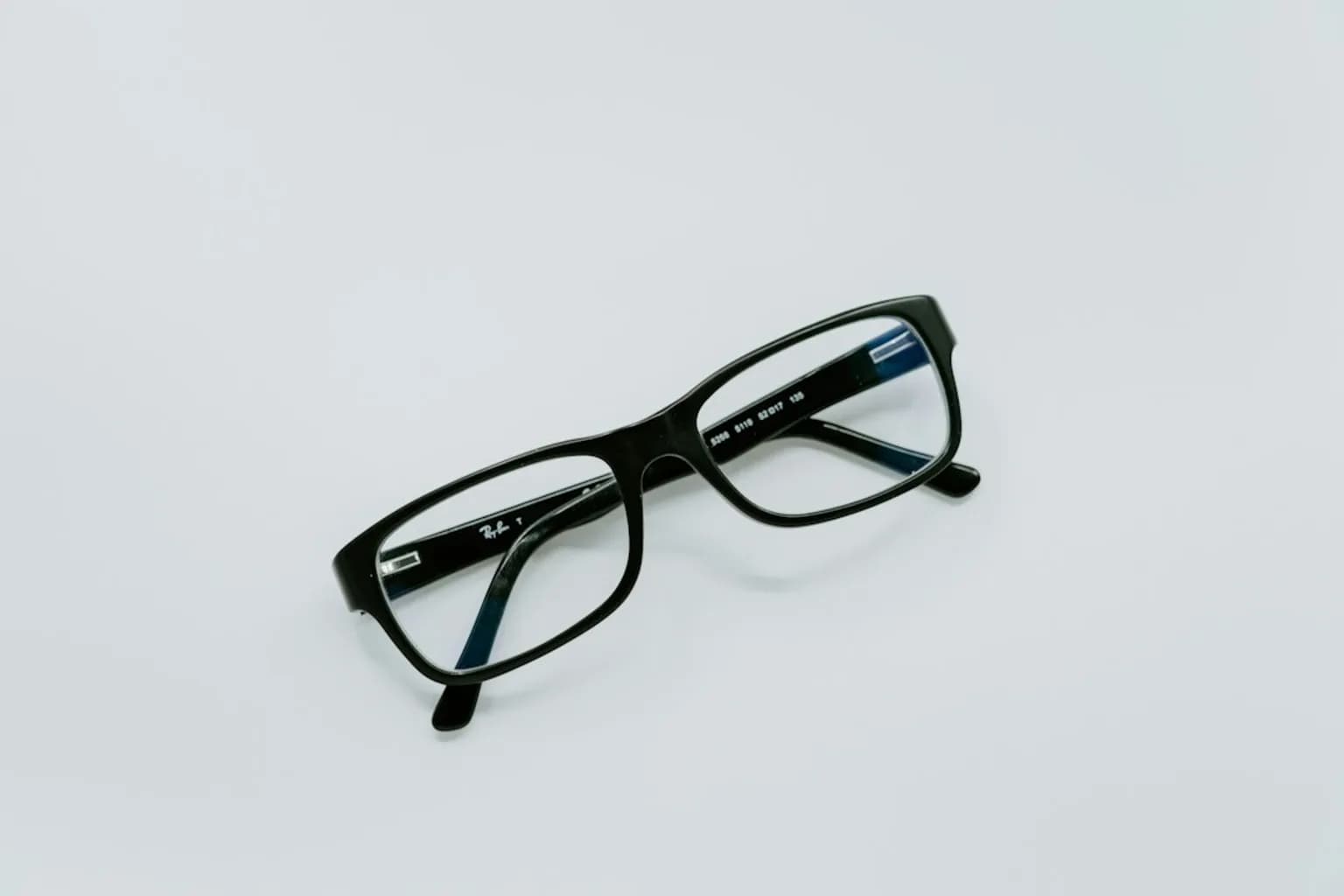 Ray-Ban Meta smart glasses with a slim frame displayed against a neutral background