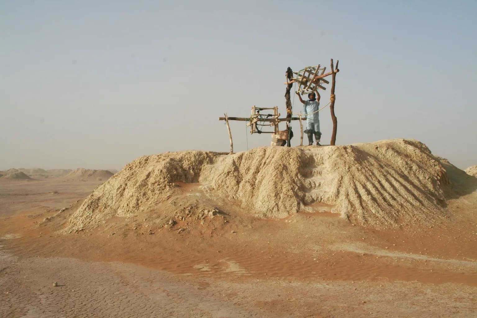 Artisanal gold miners working at an informal mine shaft in Sudan
