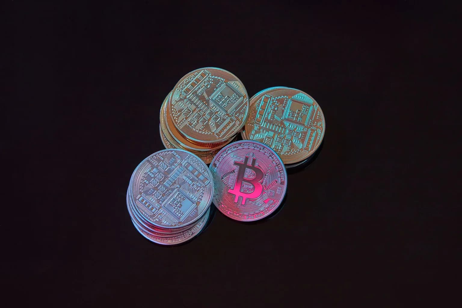 Cryptocurrency coins alongside an oil barrel, representing alleged laundering of Iranian oil proceeds