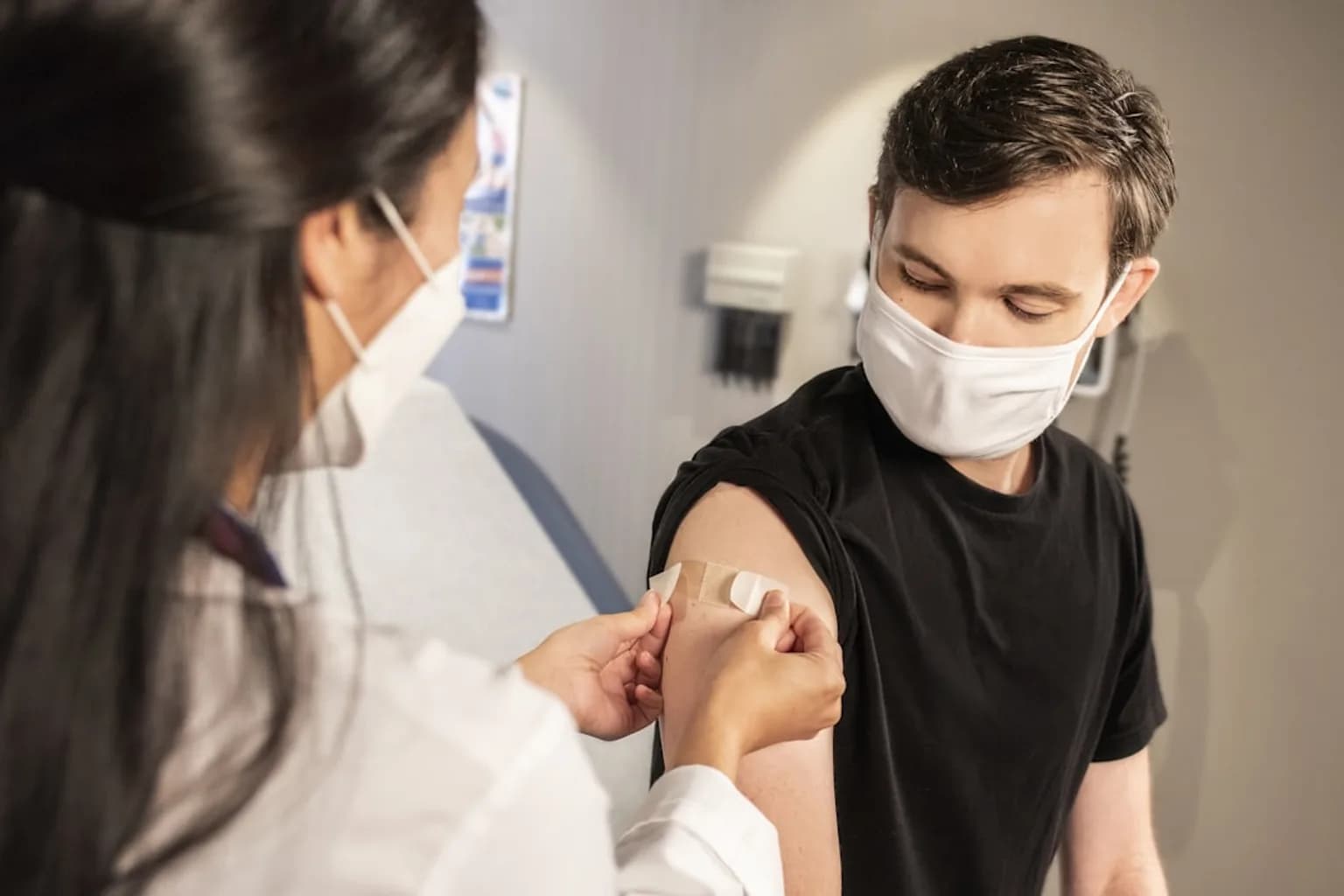 A healthcare worker prepares a measles vaccine dose