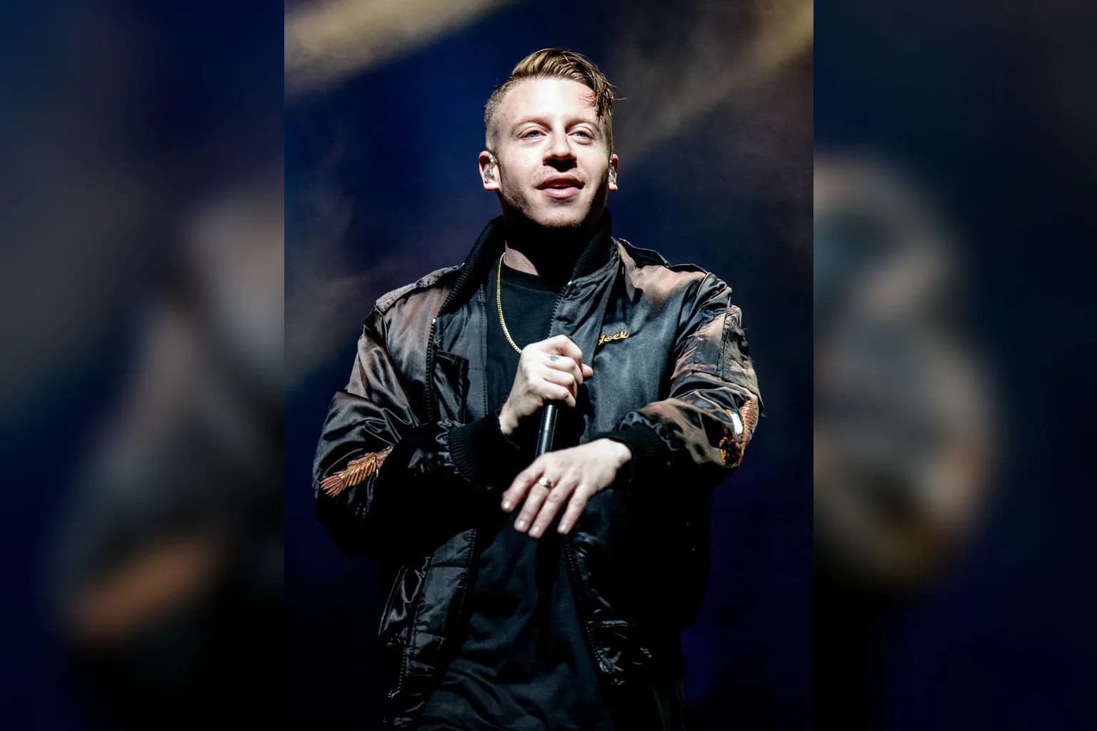 Macklemore performing on stage