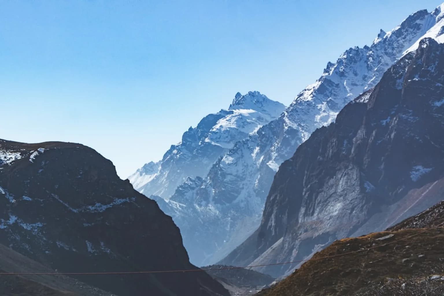 A Himalayan glacier showing ice melt and exposed rocky terrain at high altitude