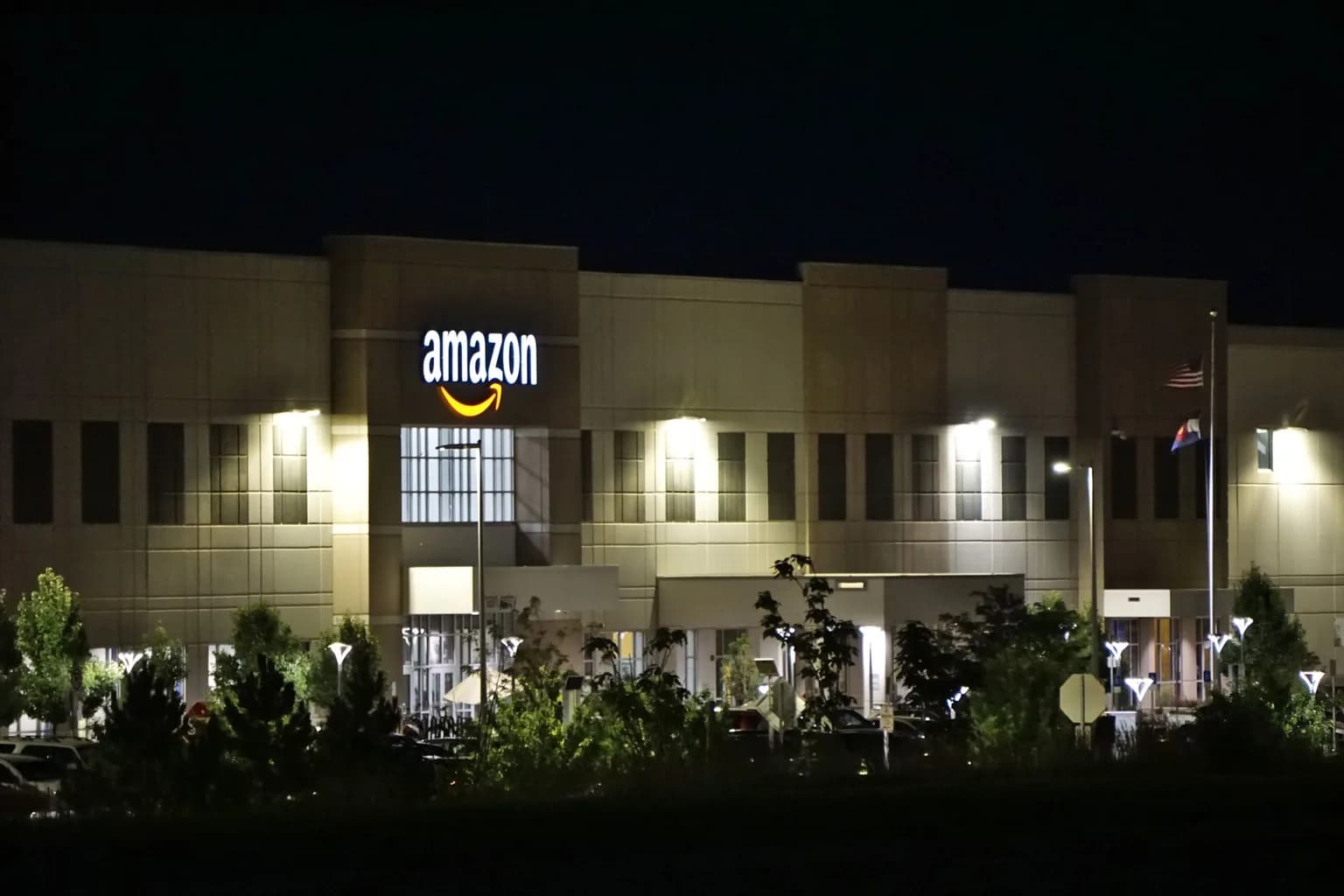 Workers inside an Amazon fulfillment centre sorting and packing orders