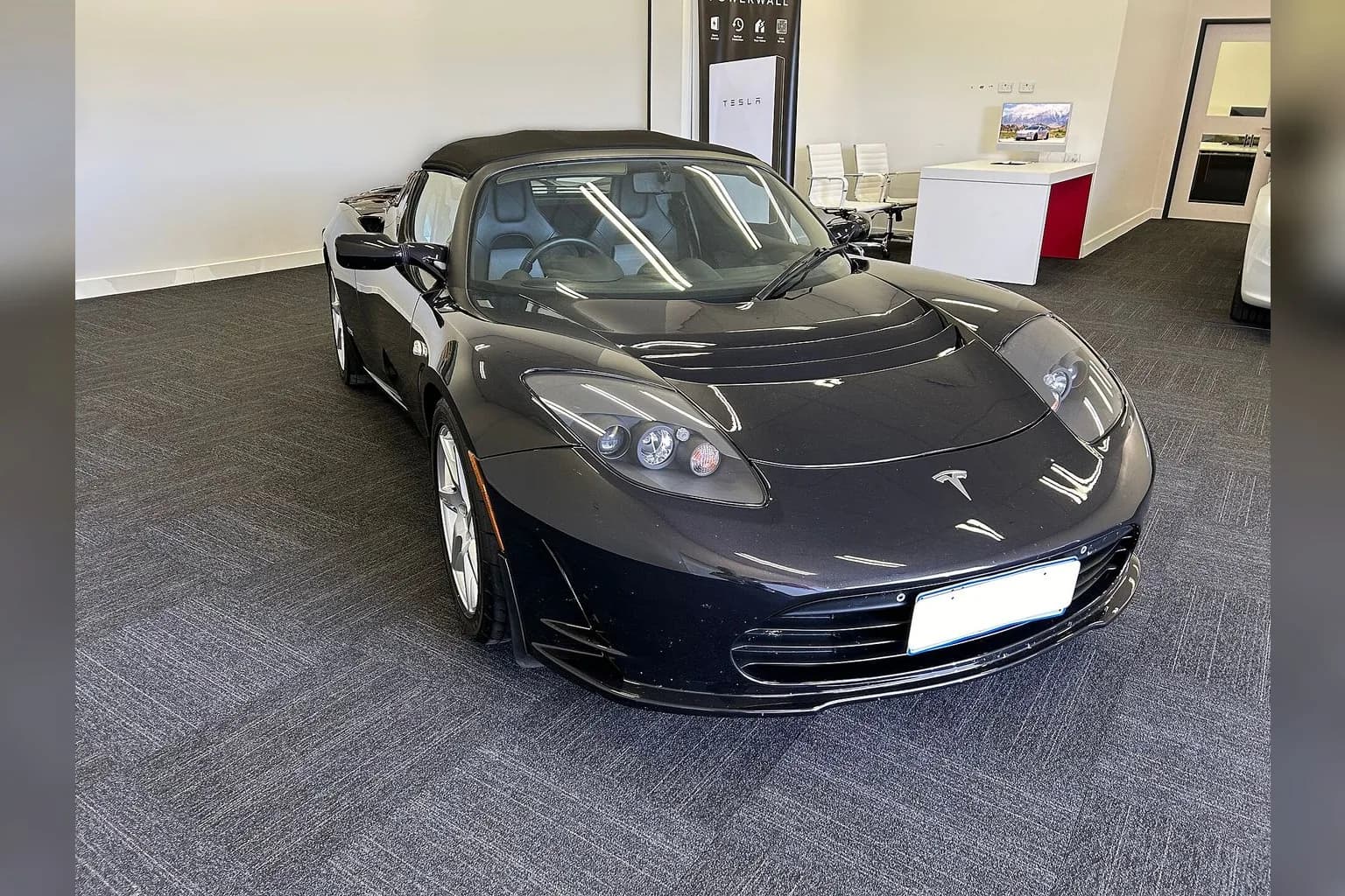 Tesla Roadster sports car on display
